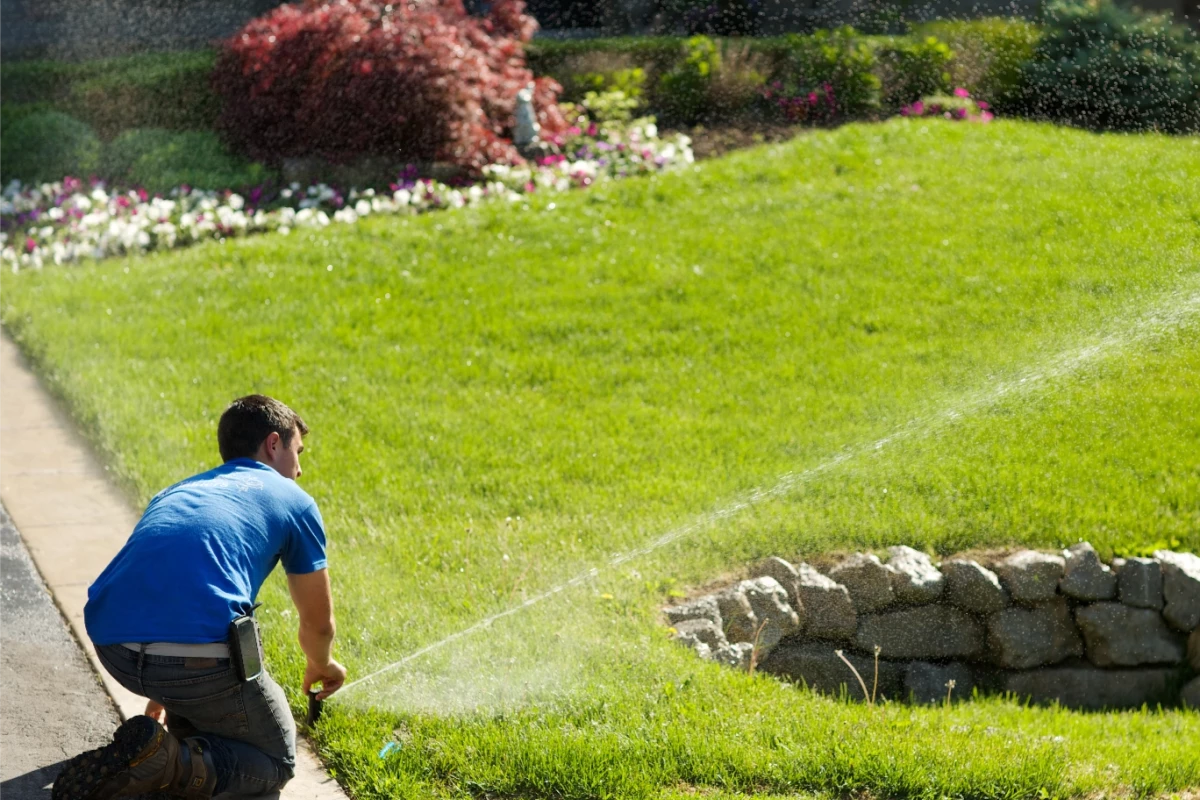 Worker work on adjusting the sprinkler